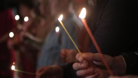 burning candles in a church