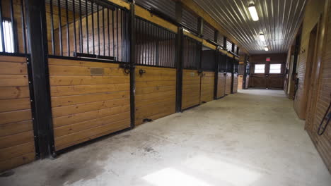 large wooden horse stable on a farm