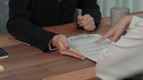 Closeup-young-enthusiastic-businesswoman-negotiate-financial-business-contract.