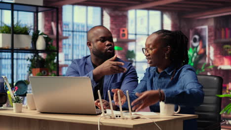 angry african american people tries to reset the wi fi modem due to signal loss