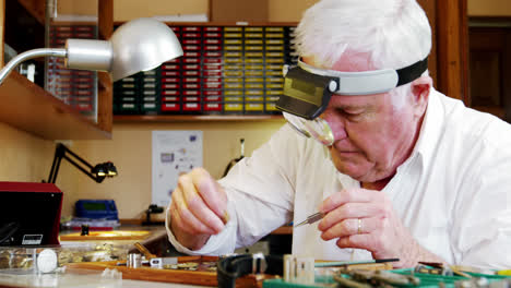 horologist repairing a watch