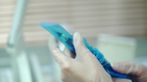 a cosmetologist is preparing a professional brush with a needle for the procedure of permanent makeup of eyes. modern cosmetology. beauty salon