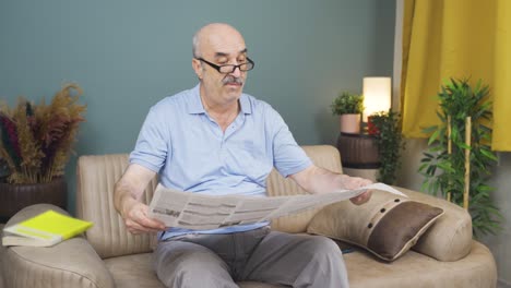 the old man reading the newspaper.