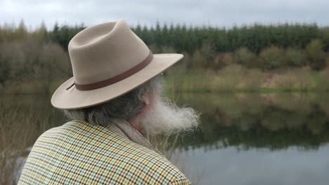 An-elderly-man-looking-out-over-the-lake