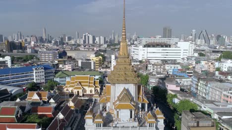 slow crane shot of wat traimit and the skyline of bangkok, thailand