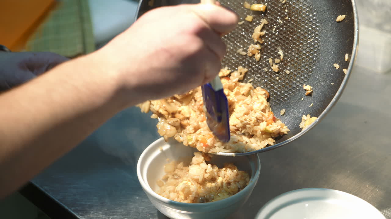 Cooking of domestic pilaf. Vintage clay bowl with traditional spicy food called pilaf
