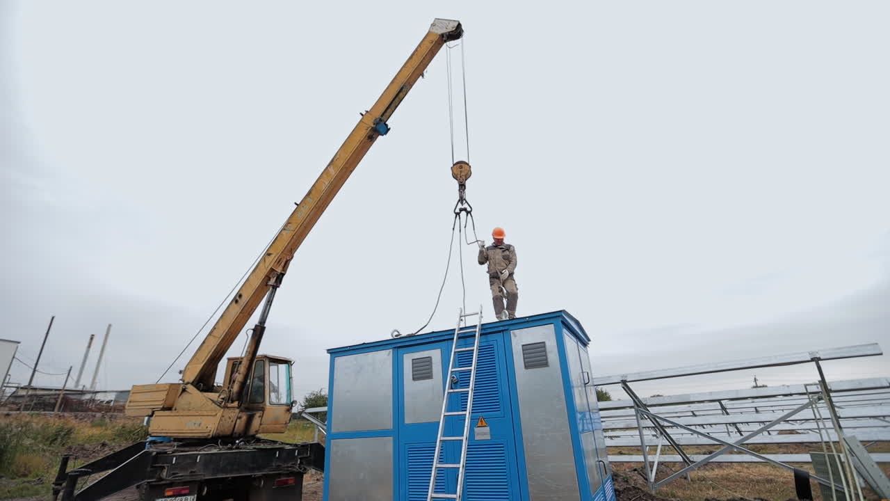 Crane Lifting Electrical Box at Solar Panel Site