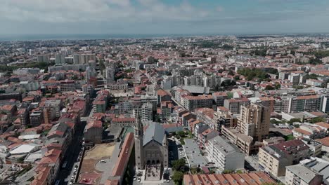 aerial - church in porto city center, portugal, dense buildings, urban landscape