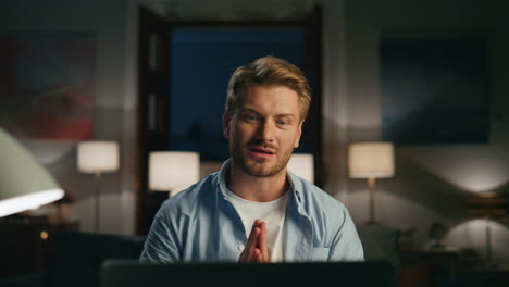 Positive-guy-greeting-laptop-at-home-closeup.-Man-confused-of-running-woman