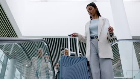 Business-woman,-luggage-and-airport-escalator