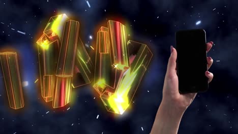 animation of diamonds moving over black background and hand holding smartphone with copy space