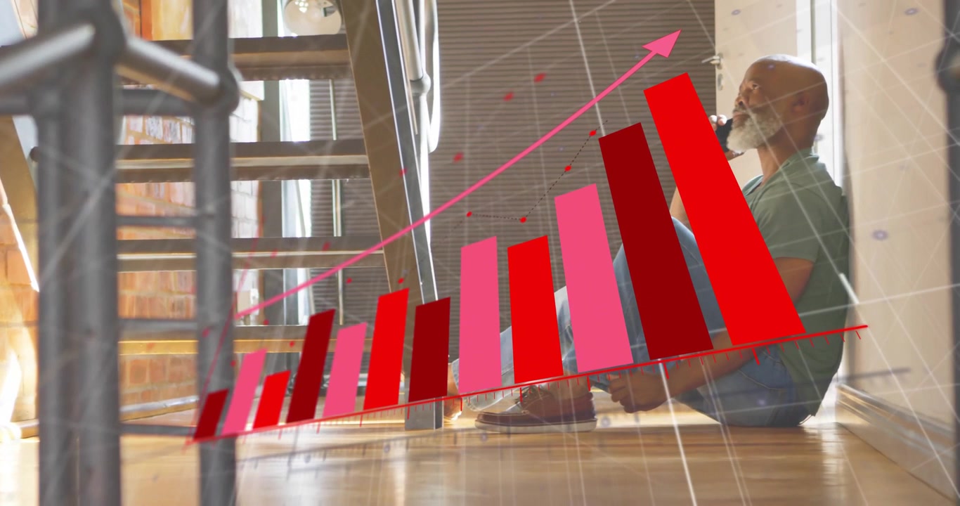Mature man under stairs on phone call watching business bar chart rising after red line appearing