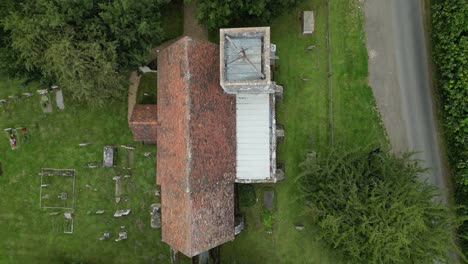 a top-down pan of elmstone church and graveyard