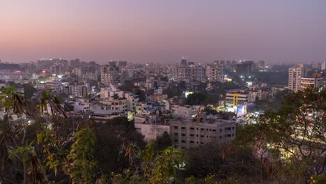 aerial view of cityscape day to night time lapse of a city, india