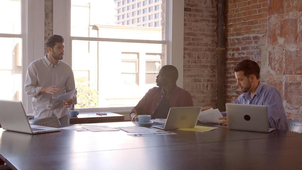 Slow Motion Shot Of Creative Brainstorming Meeting In Office