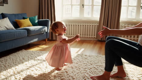 mother and baby playing together at home