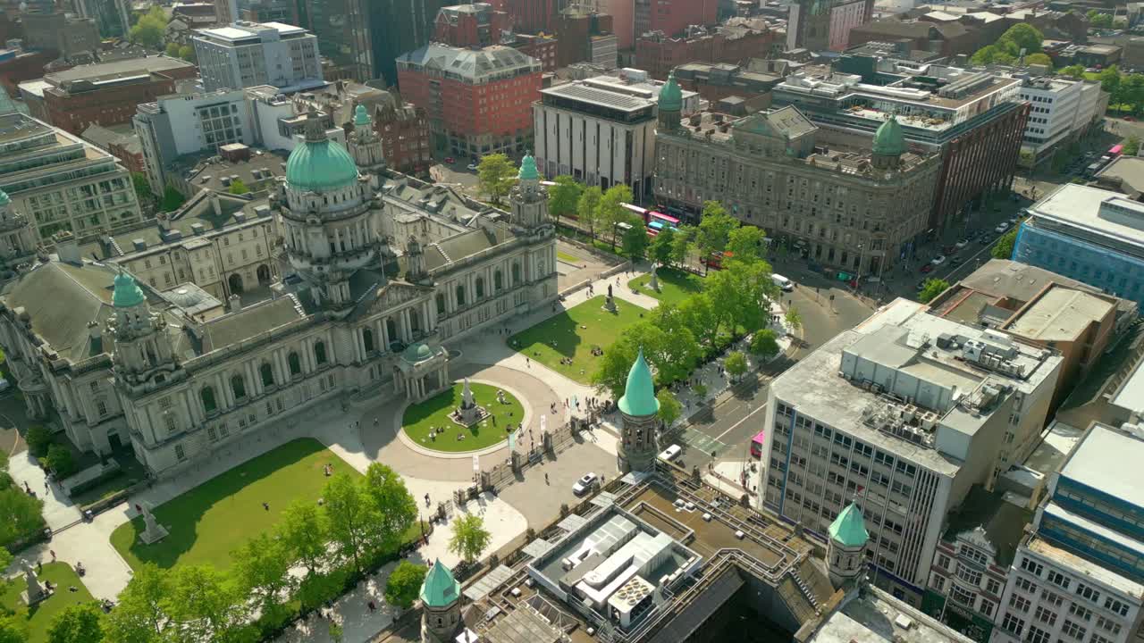 Wide aerial video of Belfast City Hall in Belfast, Northern Ireland, UK on a bright and sunny day. Filmed in 4K, 60FPS and with Rec709 Color.