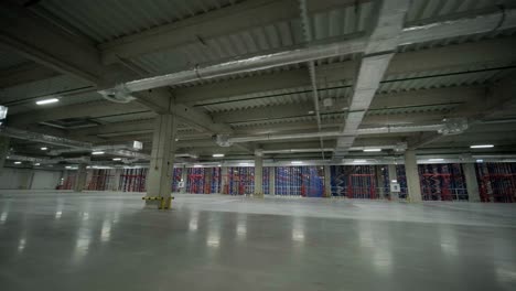 construction process of a big, modern warehouse with multiple garage gates for easy access and transportation of goods.