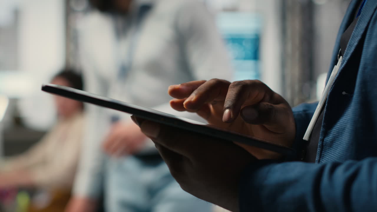 Vertical Video Close up of man reviews performance metrics insights on tablet