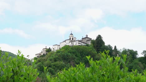 A-view-from-the-distance-of-the-Sacred-Mountain-of-Varallo,-a-christian-devotional-complex,-a-unesco-world-heritage-si-in-Italy