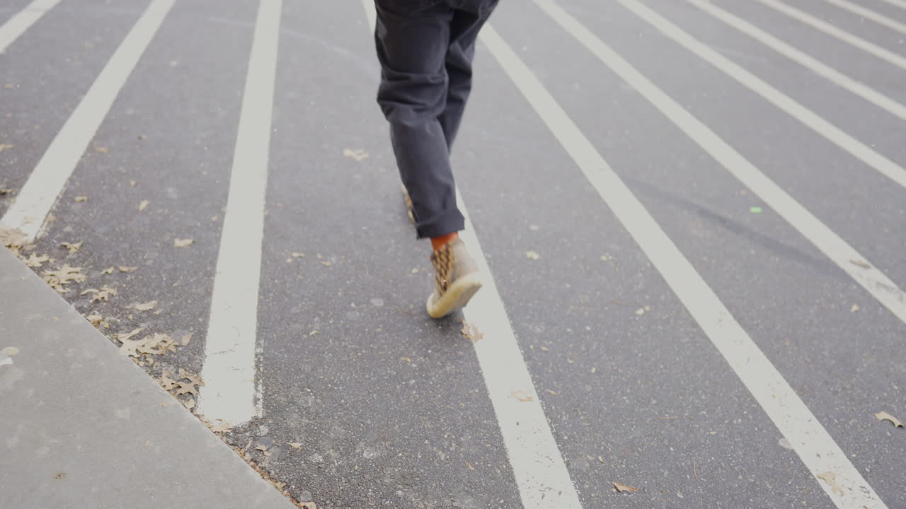 Walking behind male in shopping center.