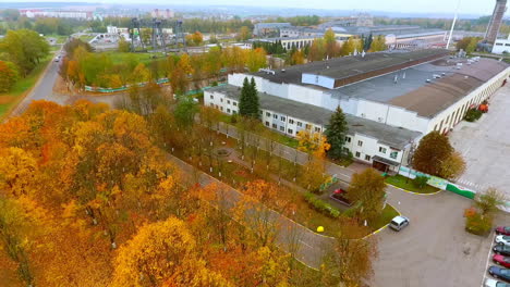 aerial view of industrial building at autumn landscape. modern factory building