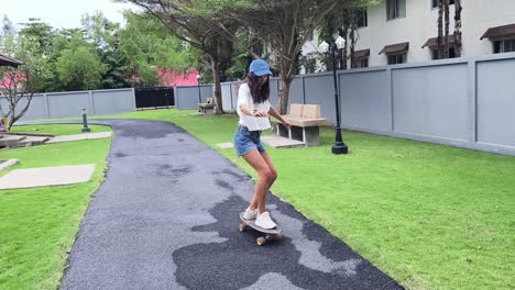 woman skateboarding in a park