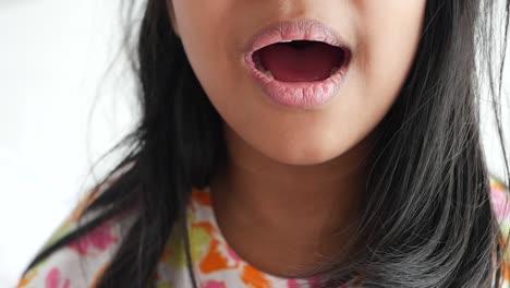 young girl smiling with open mouth