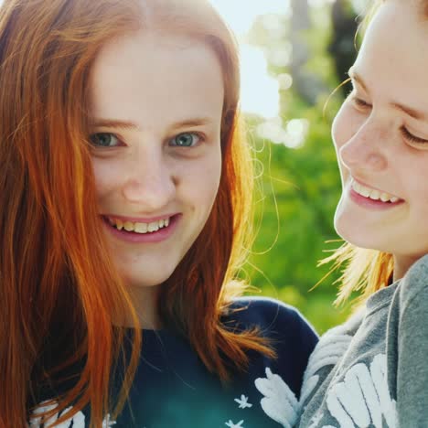 Close-Up-Portrait-Of-Two-Happy-Sisters-Twins-4