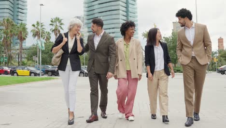 diverse business team walking in the city