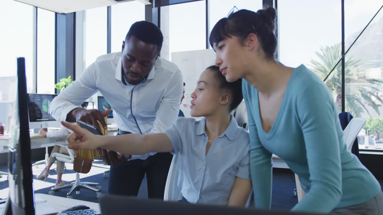 Team working on computer at the office