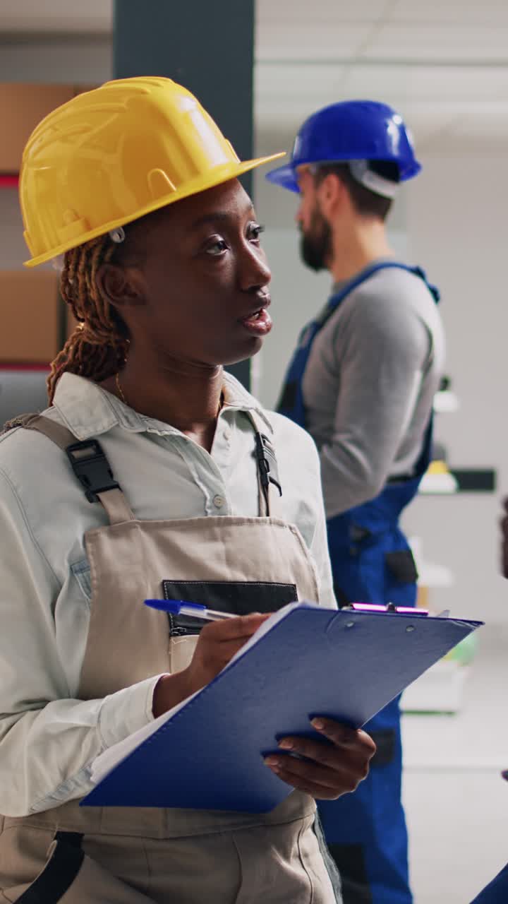 Vertical video: African american people in overalls analyzing products