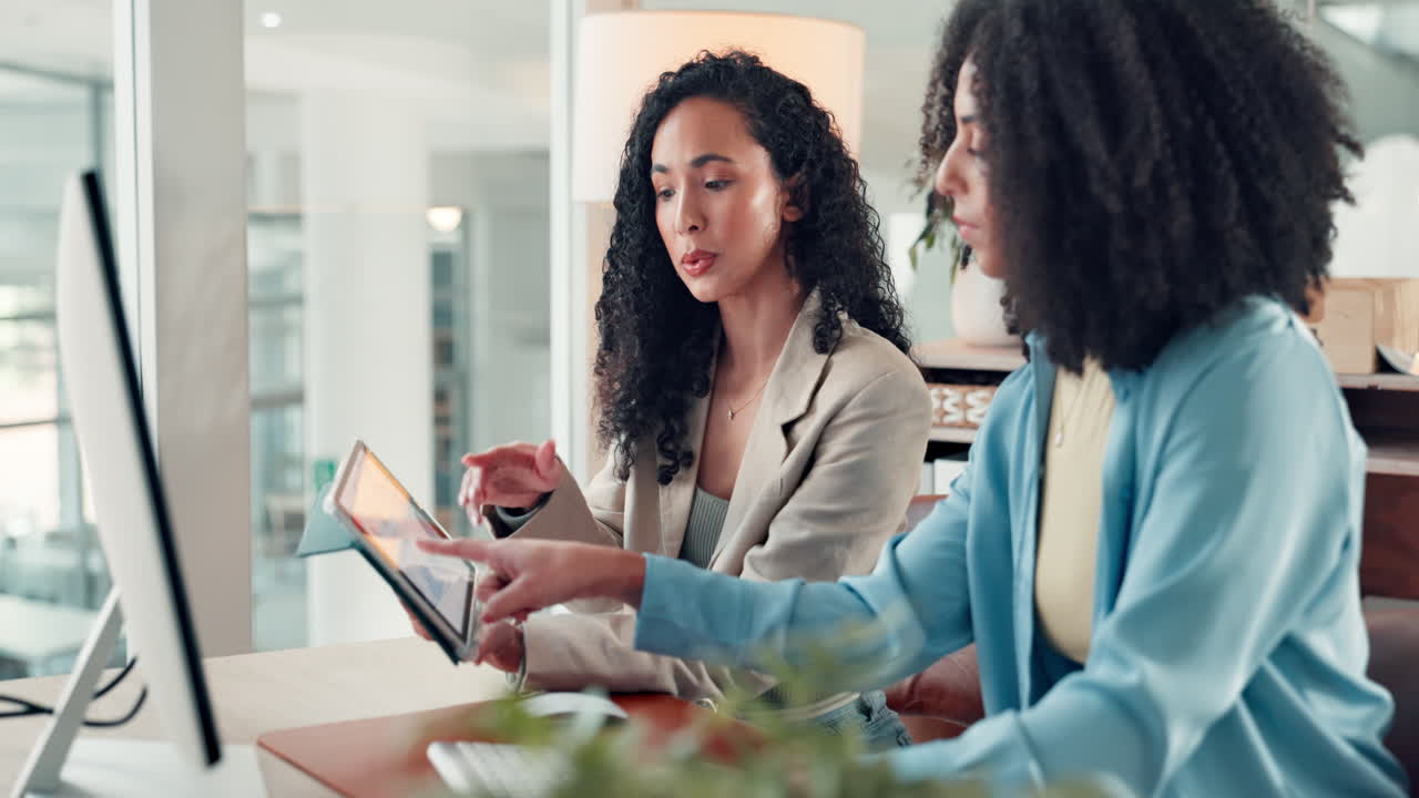 Two Business Women Collaborating at the Office