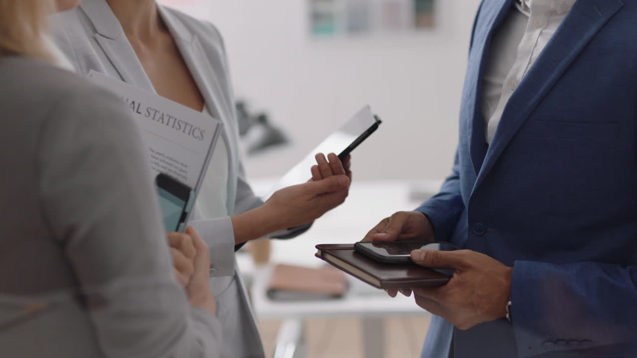corporate business people using digital tablet computer browsing data on screen discussing project collaborating planning partnership in startup office workplace