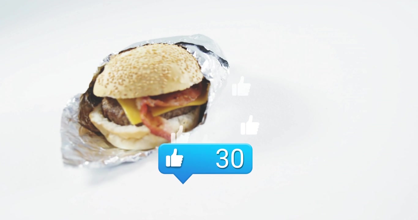 Blue bubble appearing and driving likes rising around foil-wrapped burger to 95 for marketing