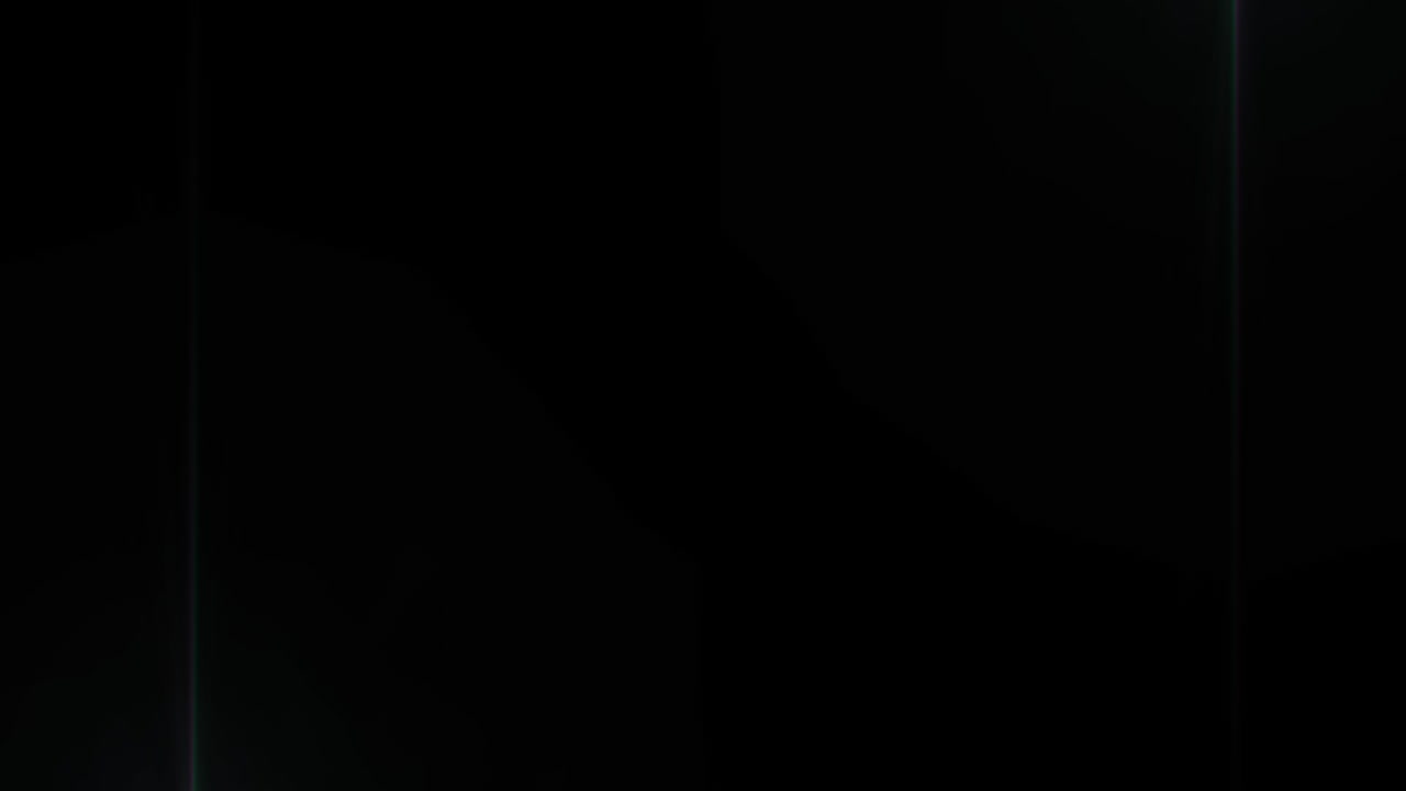 Tunnel of distorted hexagon outlines moving with spotlights on black background