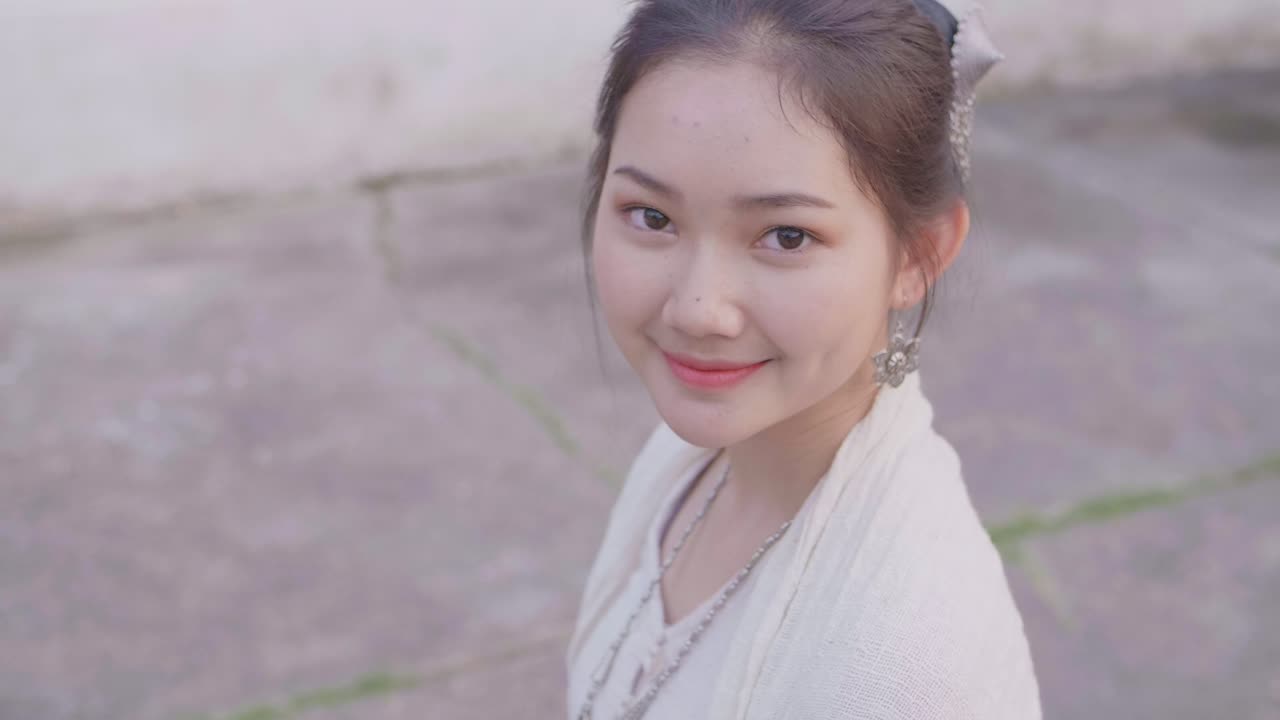 Smiling Young Woman in Traditional Clothing