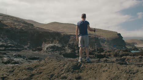 Male-traveler-walking-near-blowhole