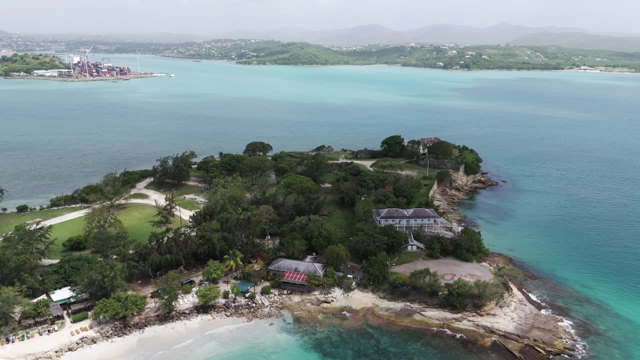 Fort james beach antigua showcasing lush greenery and turquoise waters, aerial view