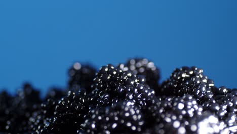 a pile of fresh black caviar rotating slowly.