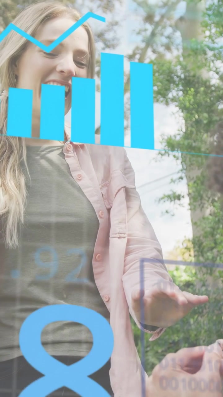 Vertical video: Woman gasping as partner placing ring, HUD ANALYSING tech charts over scene