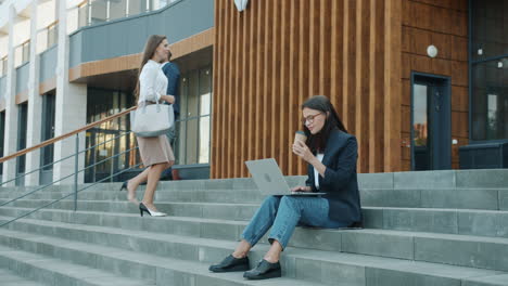business people working outdoors on stairs