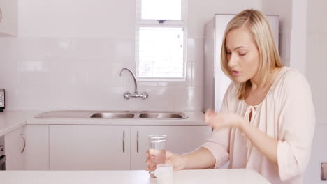 woman taking a pill