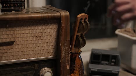 a man collects old things in a box to move from his old house. he leaves his old apartment and is sad