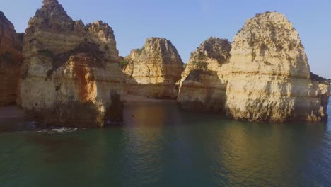 the famous cliffs and caves of farol da ponta da piedade in lagos, portugal