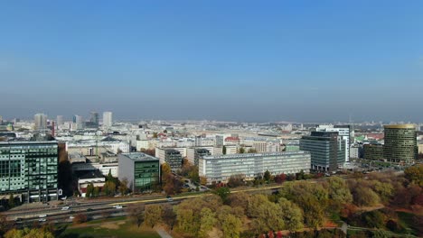 aerial of dense traffic on the aleja armii ludowej highway through air polluted warsaw city, poland, east-europe