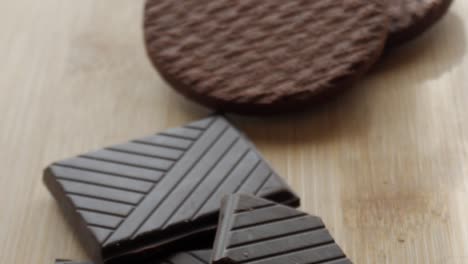 rich, textured dark chocolate biscuits, stacked on a wooden surface, ready to be enjoyed