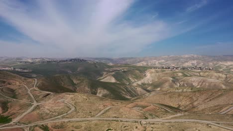 aerial view of desert hills covered with green vegetation, drone shot