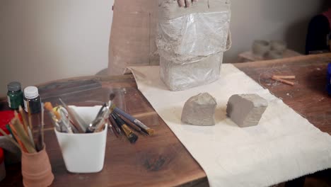 woman sculpting with clay