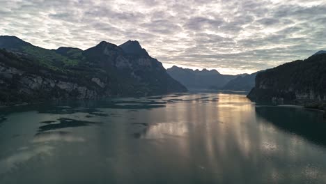 Stunning Aerial View of a Serene Lake Surrounded by Majestic Mountains